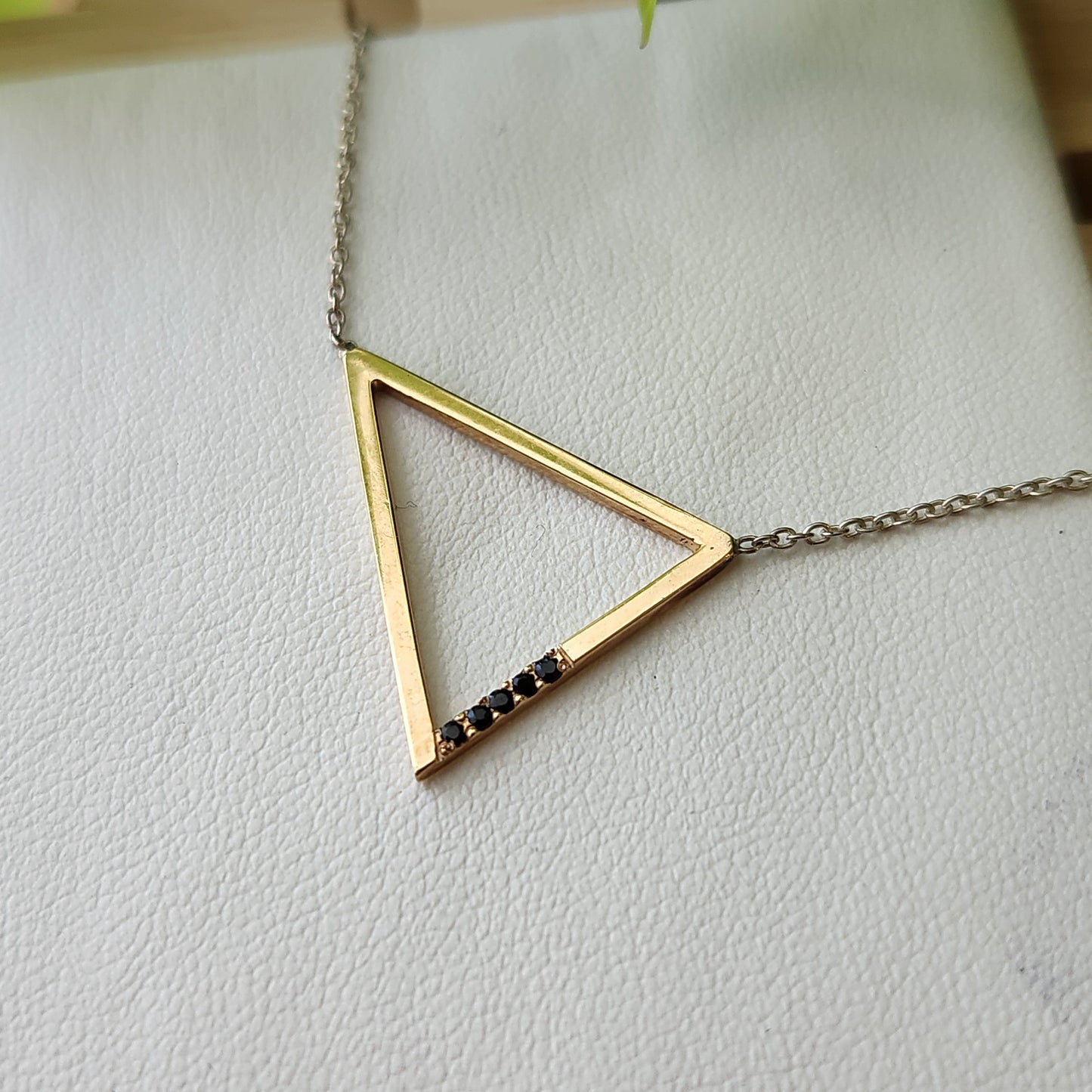 gold pendant with black spinel