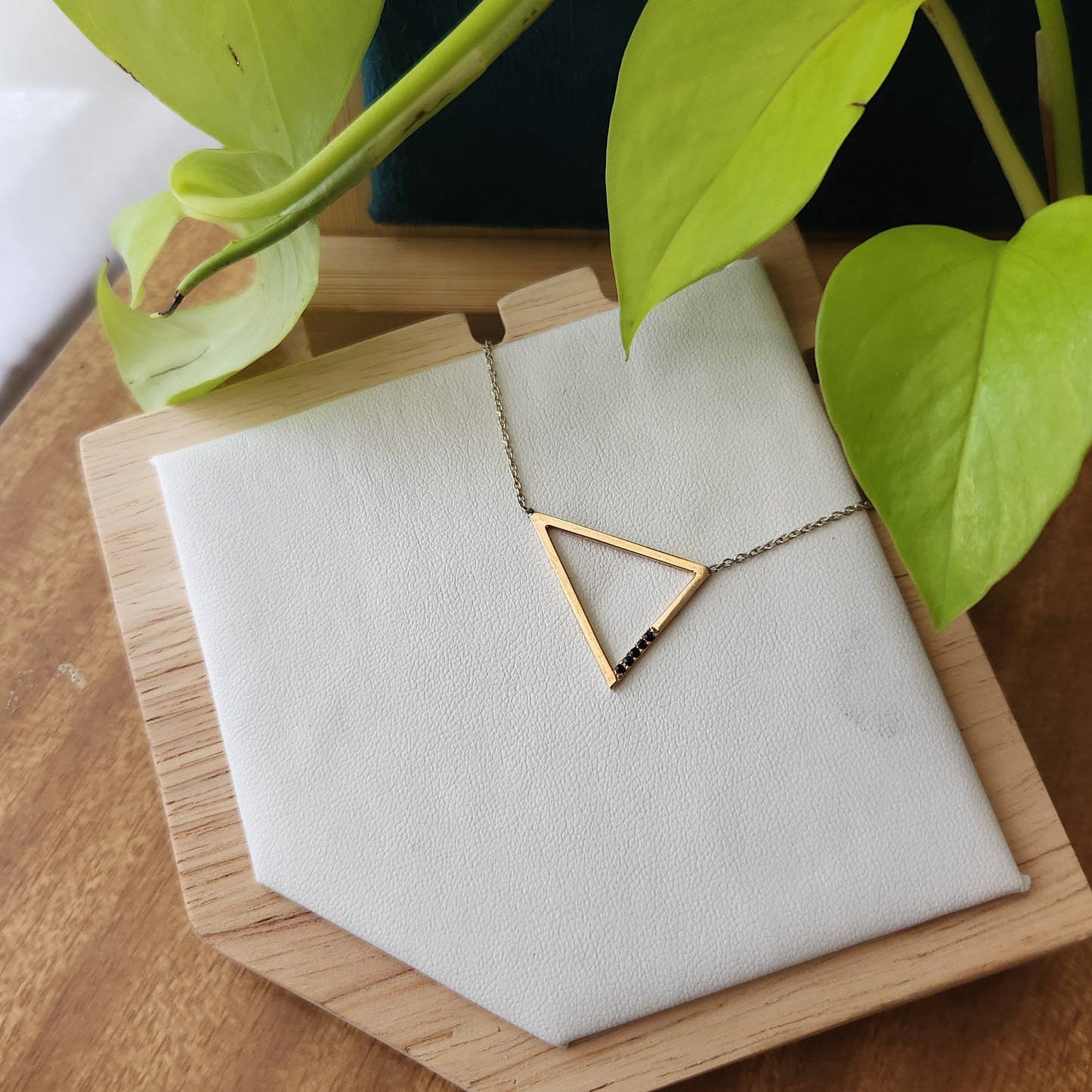 gold triangle necklace with black spinel