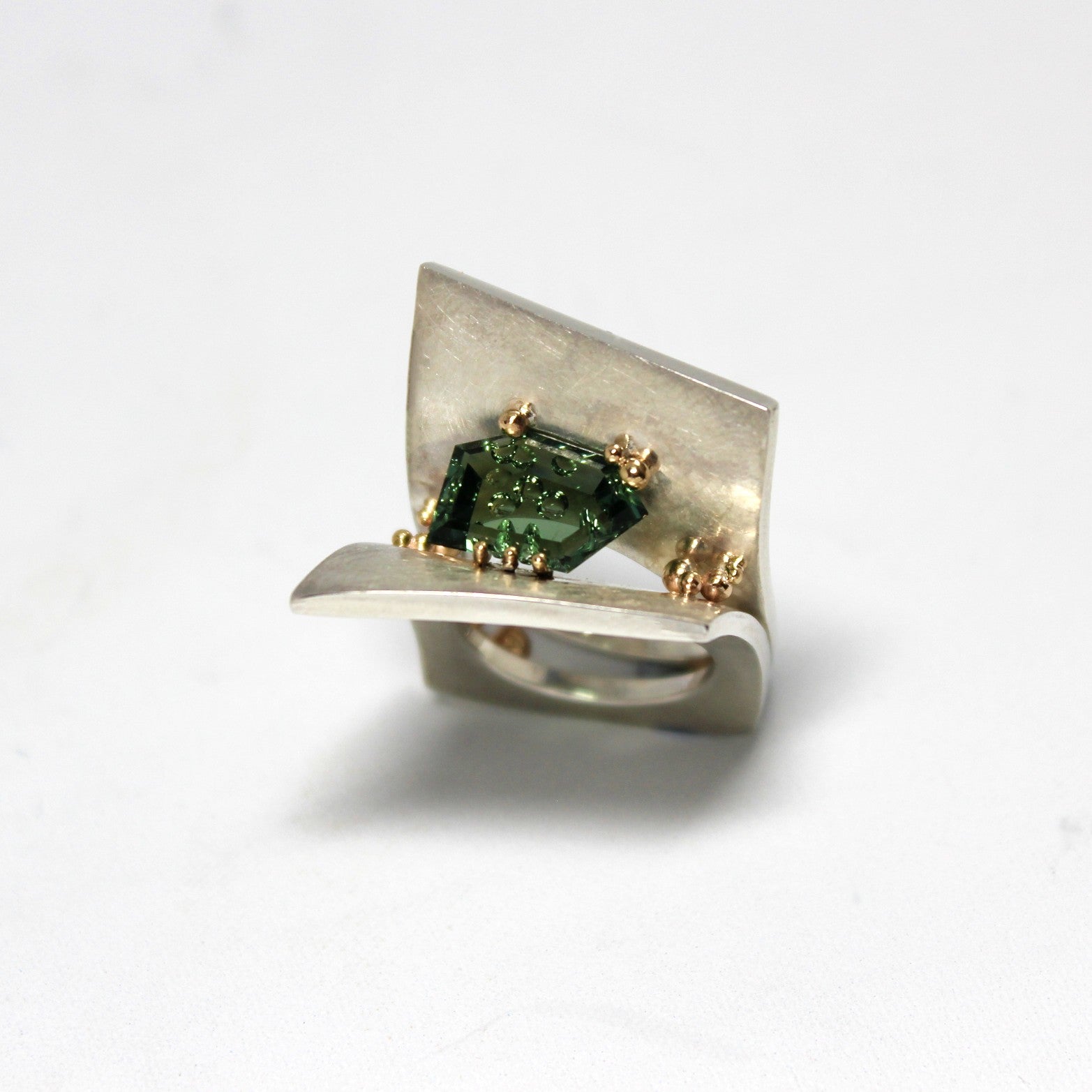 Sterling Silver cocktail ring, featuring a freeform, hand cut Green Tourmaline, with 9ct Yellow Gold granules